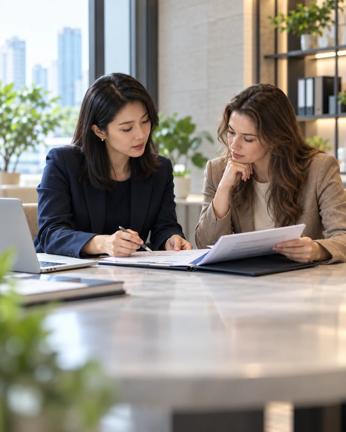 Professionals review company setup documents at an office table.
